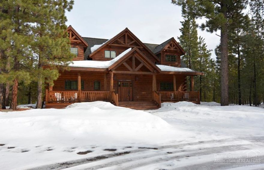 This beautiful log home nestled amongst the pine trees of Fall River Estates is a must see. This custom built home has pride in ownership throughout. The private river access is a short walk away. The home boosts hardwood floors, custom counter tops and cabinets, vaulted ceiling, and a stunning rock fireplace. The natural wood stair case sets off this floor plan. It has two master suites with one on the main level. The front and back porch bring nature to your doorstep. Come See!