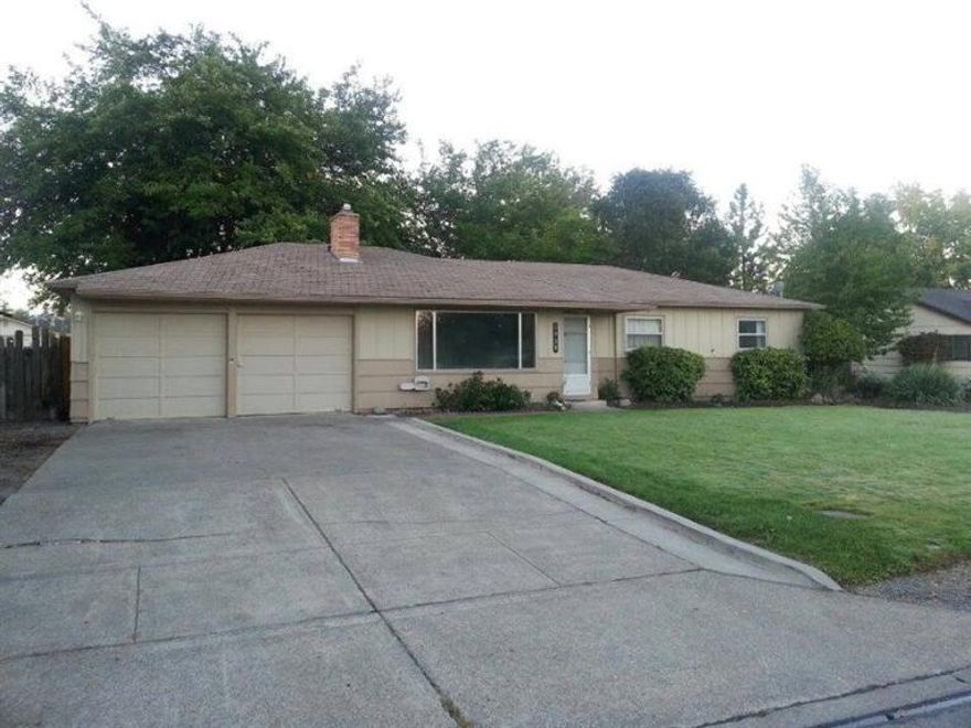 Lovely 3 bedroom 2 bath ranch in established East Medford neighborhood, extremely large .34 lot with separately fenced area for gardening with raised beds. Mature landscaping and private backyard with covered patio. Kitchen and bathrooms were updated in 2008, kitchen has newer appliances and tile flooring. Hardwood floors, throughout much of the home. Large family room off of kitchen with separate egress to backyard.