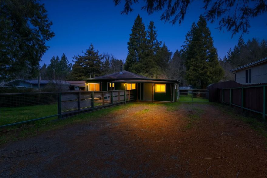 Owner carry! Have you been searching for a potential-packed home with a fenced yard and outdoor storage? Look no further! Ideally situated less than 1.5-miles from the center of Glendale, this 2BR/1BA, 1,152sqft home seamlessly combines a serene country vibe with the benefits of nearby conveniences. Step inside to envision the possibilities. The interior features a cozy living room with a wood burning stove and ceiling fan, an eat-in kitchen with an electric stove, two sizeable bedrooms, and a full bathroom with a shower/tub combo and storage vanity. Venture into the fenced-in backyard to discover a wood deck, water feature, storage shed, tons of greenspace, and a covered outdoor kitchenette with a refrigerator, concrete slab, and sink. Additional considerations include ample parking, interior laundry room/mudroom with storage, covered front porch, only 28-miles to Downtown Grants Pass, close to schools, Glendale Superstore, Glendale City Park, I-5, and restaurants, and more!