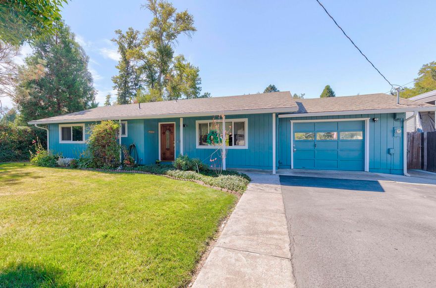 Fantastic opportunity to own a single-story home on a large ½ acre town lot close to shopping and the Three Rivers Hospital campus.  Freshly updated with exterior paint, this charming home, built in 1979, boasts 4 bedrooms, 3 bathrooms and a spacious 1,690 SqFt of living space.  Year-round Allen Creek runs across the back third of the beautifully landscaped property, adding to the serene and tranquil atmosphere of the home. The kitchen has a clever pass-through to a covered comfortable patio that looks into the backyard and flower gardens, providing a perfect spot for relaxation and entertainment.  A footbridge takes you across the creek to the back of the property where there is a hobby shed and room for a vegetable garden. A home perfect for those who love nature and want to live in a peaceful environment, while still being close to all the amenities of city life. This is your chance to own a piece of paradise in Grants Pass.