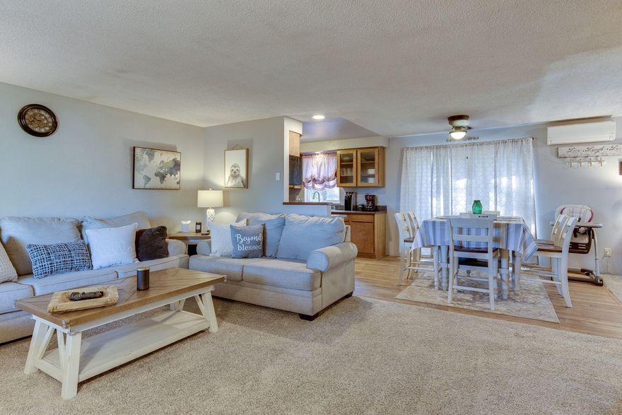 Beautiful, newly updated home being sold FULLY FURNISHED and move-in ready! Newly painted inside and out, privacy fencing, new laminate and carpet flooring, updated bathroom, new ductless heat and A/C, and many more improvements. Open living room to dining room and back deck for entertaining guests. Great home close to schools with fenced back yard. A definite must see!