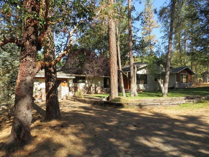 Great Price! 15.93 acres and an 1802 square foot 3 bedroom 2 bathroom home! The property is a combination of level and rolling hills. This has been a great family home for the current owners and kitchen is amazing! Dog kennel and fenced garden area to boot. Seller is willing to give a carpet allowance for the bedrooms. Jackson County has this as a single level home but there are two small steps to the kitchen and two small steps to the hall that takes you to the bedrooms. Seasonal creek behind the home. Owner has always used the garage as his shop. Located between Eagle Point and Shady Cove.