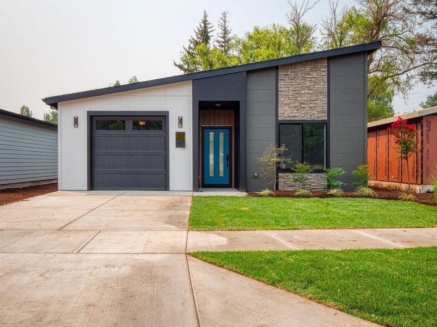 Meadows at Crooked Creek Phase 2--18 detached and 4 attached new homes conveniently located in the heart of Medford. This beautiful mid-century modern style detached single-story home by Rispoli Design & Build features 1,440 sq ft (per builder), 3 bedrooms and 2 full baths, and 100% Hardie cement non-combustible siding & trim exterior. Features include vaulted and/or 9-ft ceilings, quartz countertops, heat pump water heater, plank flooring, porcelain tile, ductless mini-split HVAC, kitchen island, s/s appliances including refrigerator, Diamond Mantra cabinets with soft-close doors & hidden hinges, fully finished garage with wi-fi opener, vinyl fencing, professional landscaping, Energy Trust certification, and much more!  Estimated completion mid-September 2024.