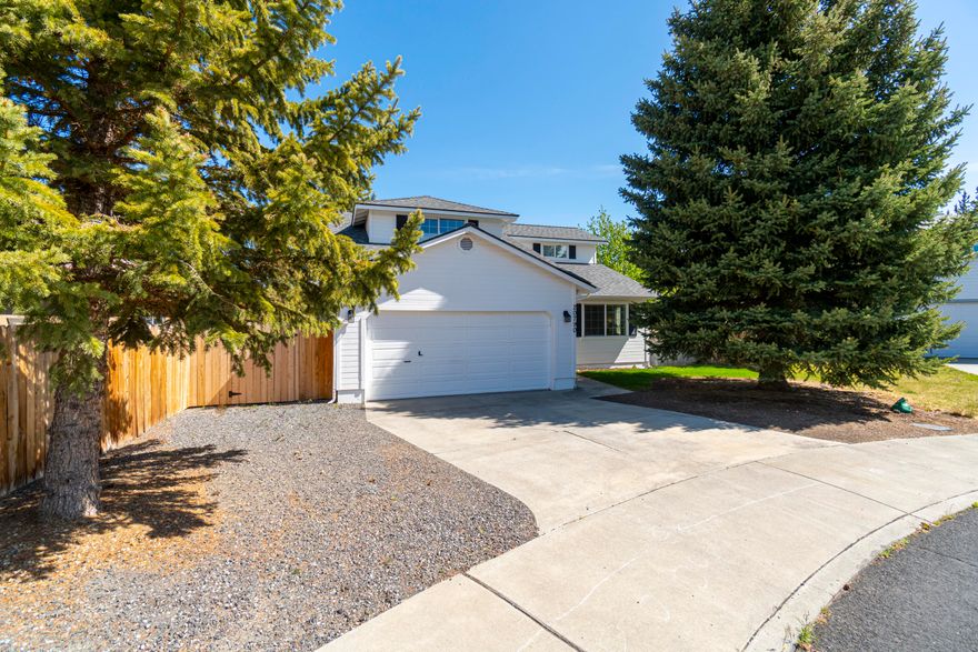 This turn-key home is beautifully situated on quiet cul-de-sac in charming NE Bend neighborhood. Many updates throughout include new roof, furnace and AC. The bright, open kitchen features granite countertops, copper farmhouse sink, stainless steel appliances, gas range with double ovens, breakfast bar and ample cabinet space. Updated main level primary suite boasts dual sink vanity with granite countertop and large tile shower. The upper level has 2 bedrooms, full bathroom, and bonus room. Landscaped and fenced yard features deck, large paver patio and plenty of shade from the mature trees. Convenient proximity to schools, parks, shopping, restaurants and recreation.
