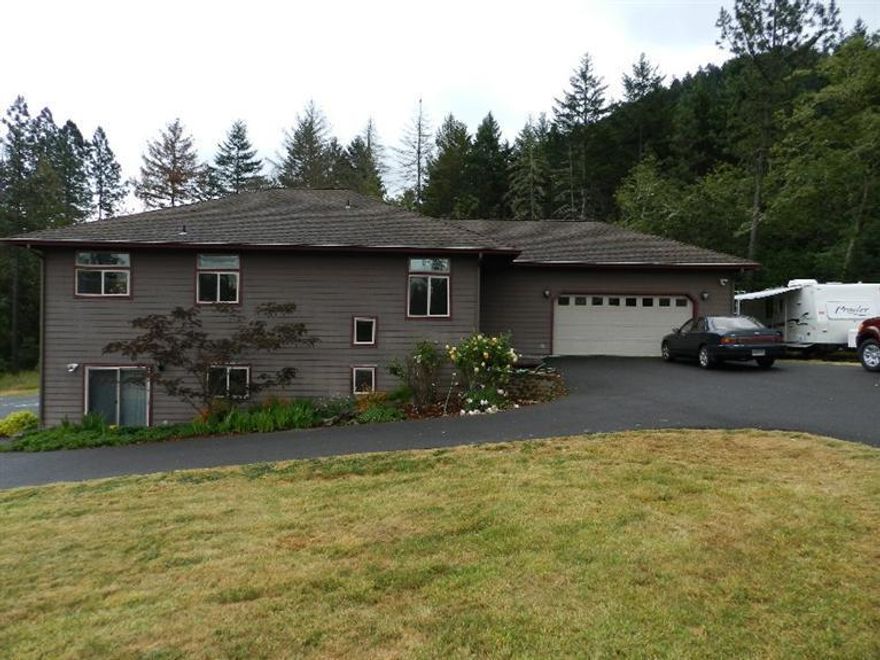 Wonderful family home! This home is for you, 4 bedrooms 3 Full 2 Half bathrooms 2850 sq. ft. on 2.73 acres. Well cared for rural home close to town. 10 foot ceilings. Open floor plan. Huge Deck for entertaining. Two car over sized finished garage. Large paved area for more parking. Even has hook up for R.V. parking. Both floors can be easily separated for guest quarters.