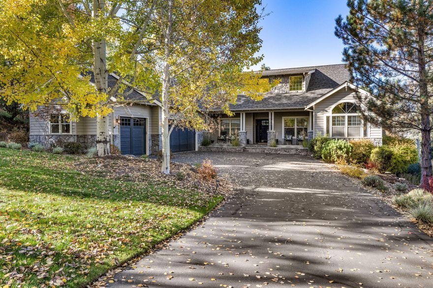 Gracious single-level home embodies timeless elegance & modern luxury. Offering versatility w/ its 3-bedroom main residence & additional 1-bed/1-bath guest quarters with private entrance. As you step inside, an impressive great room welcomes you w/ abundant natural light & a stone fireplace infusing the living area w/ sophistication & warmth. Elegant den w/ paneled wainscoting can serve as formal dining, while the heart of the home is its gourmet kitchen, w/double ovens, breakfast bar, prep sink, pantry & dining area leading to expansive deck. The primary suite is a sanctuary of refinement, w/ private deck overlooking backyard & a double-sided fireplace gracing the bedroom; extending its warmth to the bath, w/ dual sinks & soaking tub. Addtnl guest rooms & separate guest quarters, offer comfortable retreats for family & visitors. Charming front porch provides a warm welcome, while the backyard, w/ hot tub & mature landscaping, offers space for outdoor enjoyment. Spacious 3-car garage