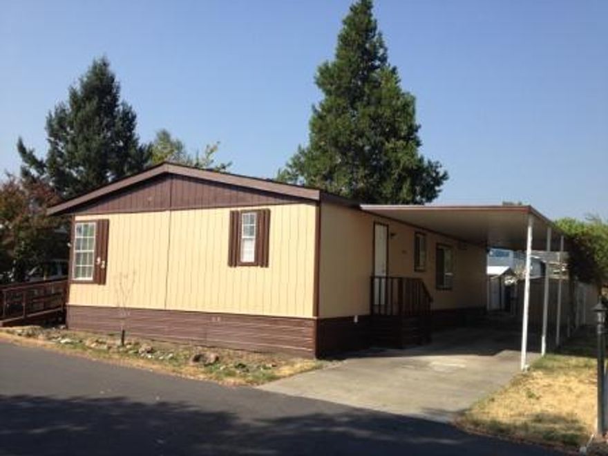 Well maintained manufactured home with split floor plan, open kitchen, pantry, vaulted ceilings, large master with soaking tub. Don't forget the covered deck and 2 outbuildings- one which has power to it. Close to town and is wheelchair accessible