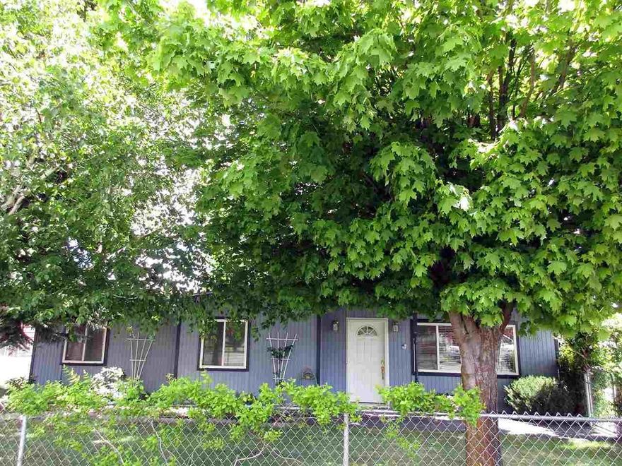 Darling 3 Bedroom 2 Bath Home With Vaulted Open Beam Ceilings, Oak Cabinetry, Gas Heat, Certified Wood Stove Plus A/C. All On .28 Fenced Acre, Gorgeous Landscaping, Mature Tees, Shop Building With Attached Greenhouse, Wood Shed, And Out Building And Covered Patio. Close To Peterson School.