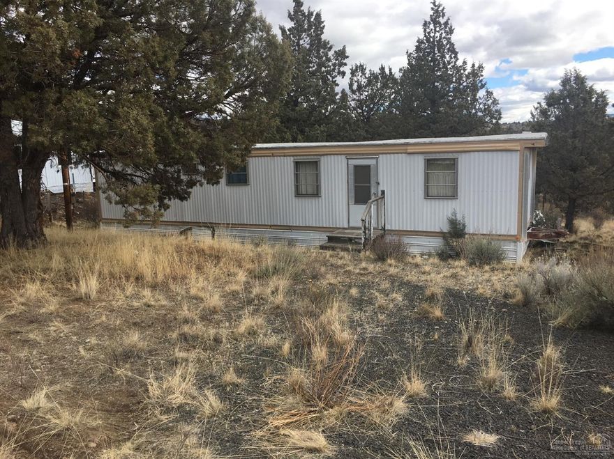Diamond in the rough? Camp site, RV storage or a building site for a new home. .53 of an acre situated outside of Prineville, just minutes from Prineville Reservoir. Fishing, Boating, Hiking, ATV's & much more nearby. Store, gas station & storage units in the neighborhood. Manufactured homes are ok here! Community water, area of standard septic systems. Plenty of room for a huge shop too! Call today!