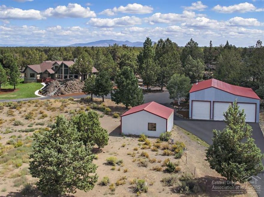 From the spectacular views of the Cascades to the freedom of exploring the bordering BLM land, this home is your own private retreat close to town. The 3,713 sf home is set back on a gorgeous gated 10 ac. parcel balanced with natural rock, mature trees and open space. A 21 ft. high elegant river rock fireplace graces the vaulted living space which flows to the wonderfully updated gourmet kitchen. Detached 2,000 sf shop with RV garage and storage plus a 2 horse stable. This is truly a special property.