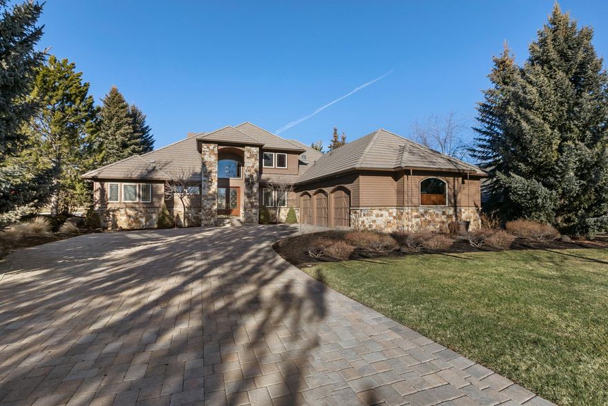 Broken Top Estate Home. Spacious great room, formal dining room, gourmet kitchen and breakfast nook all enjoy Broken Top golf course views beyond the landscaped back yard featuring ponds & waterfall. 
Primary suite and two bedrooms (currently being used as office and den) on the main level with two more full en-suite guest rooms and bonus room on second level.