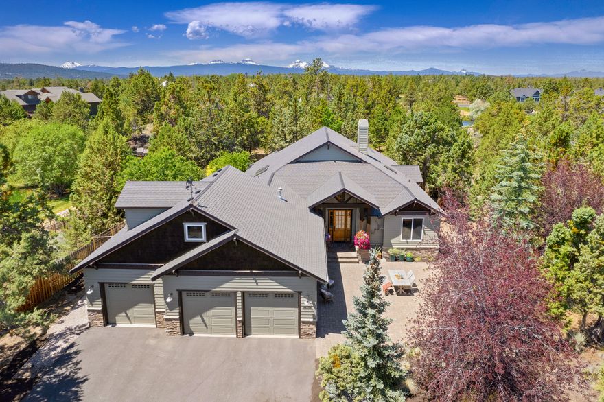 Beautiful Northwest style home on 2.5 acres with a SHOP! Private setting with 1.25 acres of irrigation rights and backs to the seasonal Historic Pilot Butte Canal. SINGLE LEVEL living with upstairs flex space above the garage that can be used as a 3rd bedroom, bonus room or workout room. Light and bright with sky lights and picture windows. Primary bedroom and additional guest suite are on the main level. Large great room with gas fireplace and vaulted ceiling. Kitchen with island has stainless steel appliances, granite counters, built-in refrigerator and an induction range. Office with French doors and built-ins. Primary bath has walk-in closet, jetted tub, tiled walk-in shower, dual vanities and Toto toilet/bidet. Enjoy the large front and back paver patios, expansive lawn and fenced garden area with green house. Detached 2208 SF SHOP with forced air heat and half bath. Close to Pine Nursery Park.