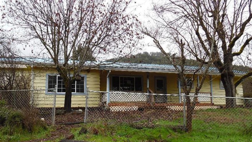 Opportunity abounds in this quiet neighborhood with beautiful views of the nearby mountains and close to the Rogue River. Main House with multiple outbuildings and enough room for all your toys.