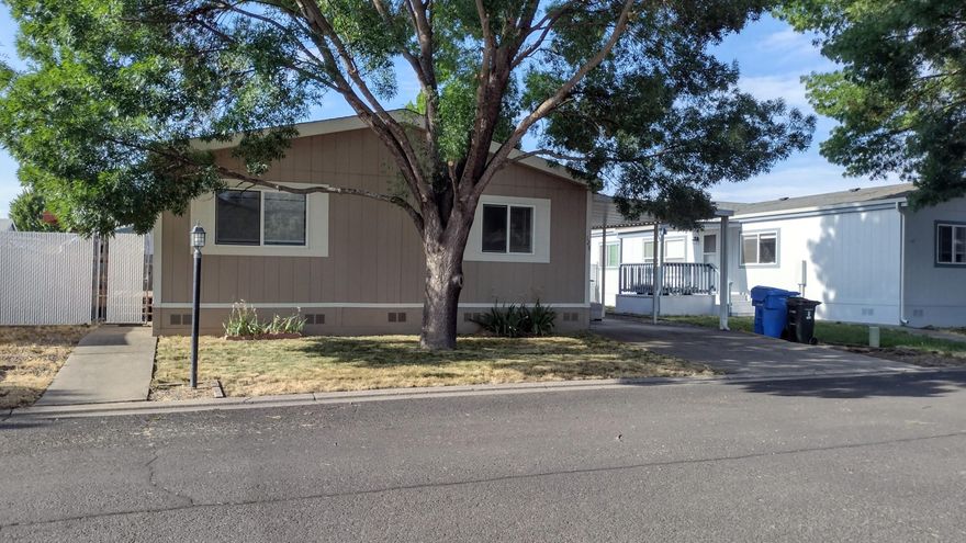 Nicely maintained home in the popular Butte Crest Mobile Home Park in the charming town of Eagle Point, OR. This is a park for all ages. The home has a 2 year new HVAC system. It has the main bedroom and ensuite bath at the back of the home with the other 2 bedrooms at the other end. The main bath has been updated with nicely accented ceramic tile. There is a huge pantry in the laundry room adjacent to the kitchen. The dining room has a dramatic accent wall which is easy to paint if you hate it! There is a nice front deck and a small patio off the back/parking area. In the storage shed is a work bench and shelves . A Google Nest thermostat is included. Bedroom #2 has a bigger closet and is larger than bedroom #3. The yard is fully fenced and gated. There is room to expand the landscaping or maybe add an above ground pool? The home is move in ready!