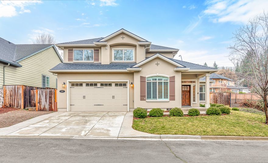 Desirable location!! Stunning East Medford Hills 4 Bedroom 2.5 bath w/ bonus room. Custom stucco and interior design/floor plan. Kitchen with 10FT granite top island, stainless appliances (included),granite counter tops, tile backsplash,under cabinet lighting, pantry and built in desk.Living and dining area are open to the kitchen to provide ease for gatherings/entertaining. Bonus room is perfect for media room, play room, home office or weight room. Primary suite downstairs w/large walk-in closet, bathroom with dual vanity and custom shower. Sliding glass doors off this suite go to the hot tub. Upstairs 3 more bedrooms and bathroom with dual vanity. Backyard fun with this easy care yard, covered patio, extended concrete patio, built in hammock and HOT TUB ( included). Come take a tour of this beautiful home.
