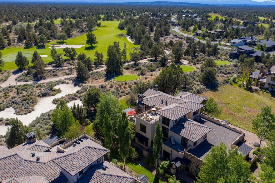 This fantastic villa in the heart of Pronghorn Resort is a furnished, turnkey townhouse. Enjoy a westerly view of the 17th fairway of the Nicklaus course and Cascade mountain views from the second story bedroom - complete with spacious patio and outdoor fireplace. A spiral staircase leads to the bonus, third story library with wet bar, private patio and fabulous views. This gorgeous property features en suite bedrooms, powder bath, utility room, stone fireplace, hickory flooring, granite counters, wet bar with beverage cooler, a 3-car garage with epoxy floors, an outdoor kitchen and fire pit on the back patio, and a beautifully landscaped courtyard.