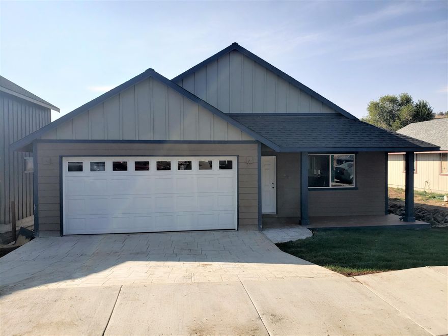 Nicely appointed, new construction home on Madras' SW side. Offering a front porch, hard surface counters and stainless steel appliances. The backyard is spacious with endless possibilities. Close proximity to shopping, amenities and schools. City states street will be paved in 2021.