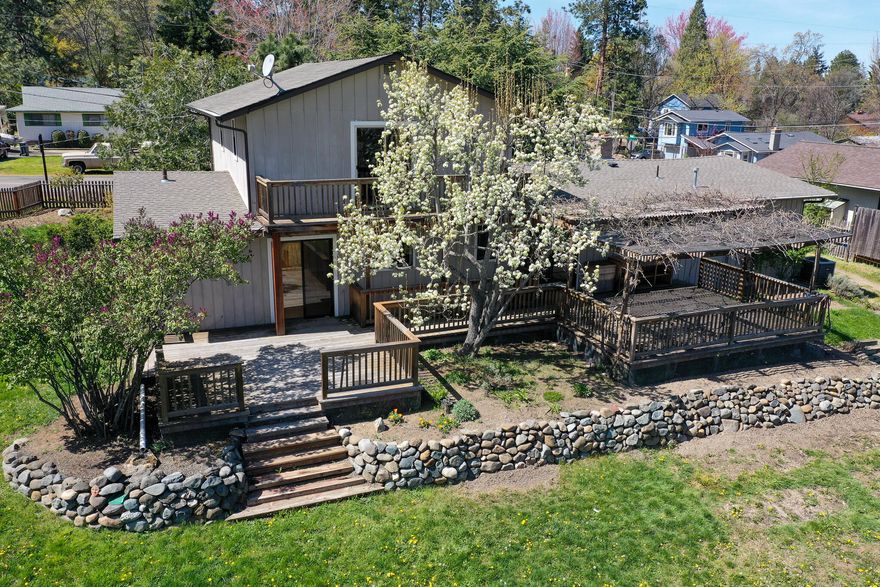 Best of both! Country meets town in these 2 properties with TID irrigation--being sold together.1330 is partially renovated. Remodeled kitchen opens to extensive decking and views. Also on main level: livingrm, fireplace; primary bdrm/bath;, 2nd bdrm; half bath; office/familym. Upstairs: 3 bdrms, 1 bathrm. City water/sewer. Older 1-room cottage with clawfoot tub, sink, toilet; storage bldg with skylt; vintage wood shed. 0.3 acre TID. 1318 adjoins the back of 1330.This half-acre has beautiful mountain views, older barn. Water had been pumped up to a garden & greenhouse (removed.) 0.4 acre TID. Fencing is inside boundary. Buyers to do their own investigations for use. Prior owner did proposed site plan for a house, approved in 2005. It is not known if a house, well and septic can currently be built. Listing price was reduced accordingly.