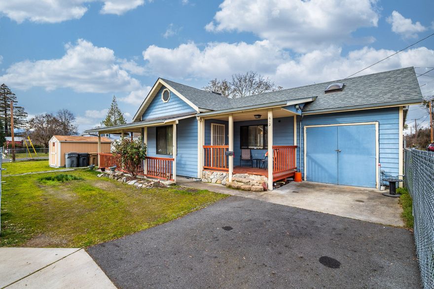 Charming home located just minutes from downtown Grants Pass!  Perfectly set on a .12-acre corner lot sits this adorable two-bedroom, one bath, 865sqft cottage style home is ready for the taking.  Enter from the welcoming front porch into a cozy floorplan that includes a living room with french doors that lead to the covered patio, a functional kitchen with stainless steel appliances, an eating area, two bedrooms, one bathroom, a laundry area and a bonus room above the garage, perfect as a guest room and/or office.  Additional amenities include an energy efficient gas heating and air system plus a hot tub under the covered patio.  So much potential here on this spacious corner lot with two storage sheds, RV parking, a small garage/workshop and plenty of room for a garden.  All this conveniently located just minutes from shopping, restaurants, and District 7 Schools! Possibilities are endless for first-time home buyers, investors or whoever!  Call today to schedule your appointment!