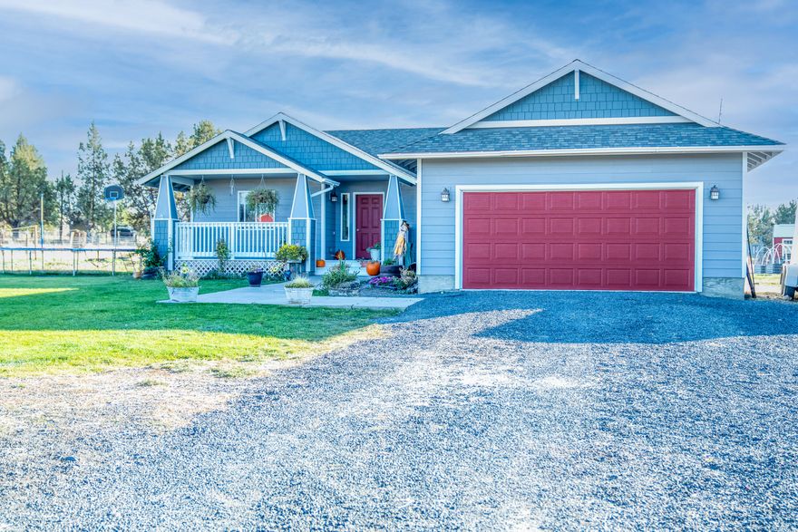 This one checks all the boxes... 2.15 acres, perimeter and cross fenced almost completely with no climb fencing. 1544 sqft home, 3 bedroom, 2 bath, covered front porch and attached garage. Garden area, raised garden beds and fruit trees. Barn with lean to on each side, dog run, custom chicken coop. Livestock allowed and road is paved all the way to the driveway.