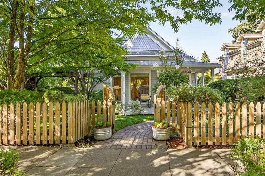 Charming and beautifully maintained, this Ashland cottage captures the essence of the Railroad District.  The main home offers 1,221 SF of inviting living space, filled with natural light and designed with warmth and comfort in mind.  A welcoming front porch, bright kitchen w/custom cabinetry, and spacious primary BR create the perfect blend of character and function.  Tucked behind the main house is a 704 SF detached guest cottage with its own BR and BA-ideal for extended family, private office, or art studio.  Together, the two dwellings provide nearly 1900 sq. ft. of versatile living.  The storybook backyard is a private retreat with mature landscaping and garden spaces for outdoor enjoyment.  A short stroll brings you to Ashland's restaurants, shops, theaters and Lithia Park.  This is the Ashland dream-an enchanting home, magical setting and in one of the most sought-after locations.