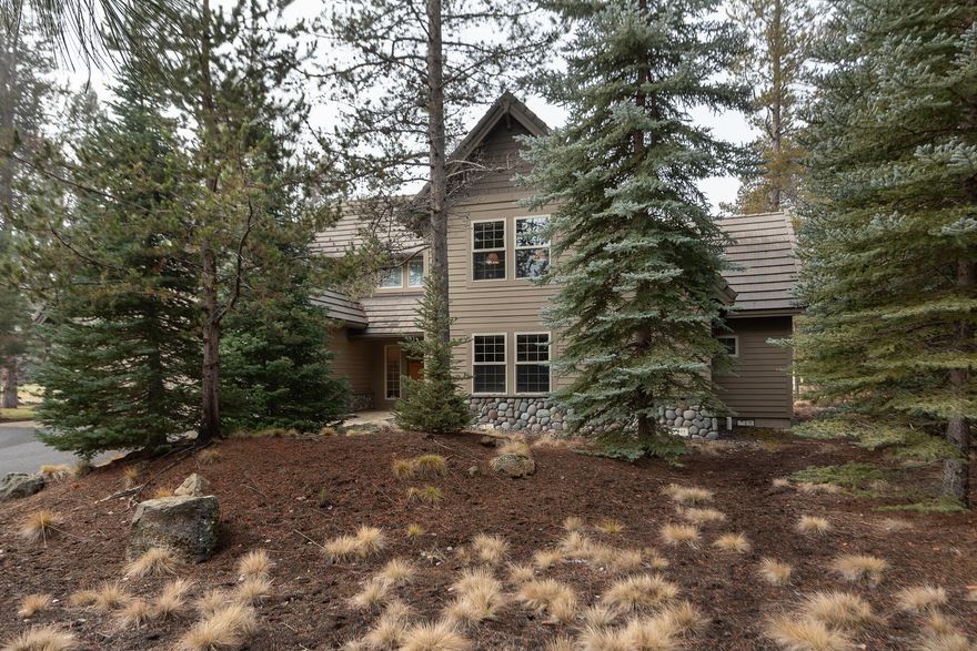 First time on the market since 1999! 
Making memories is what it is all about in this impeccably kept, classic Sunriver 2-level on sought-after Bunker Lane backing to Woodlands Golf Course. This vaulted great room plan features top-quality finishes and upgrades including a dramatic river rock, natural gas fireplace & a wall of oversized windows to a peaceful golf course and wildlife view.Updated and upscale kitchen with Bosch appliances, granite counters & breakfast bar, open to a large dining area showcasing hardwood flooring and light open common spaces.Also featured on the main level is a roomy master suite and second ensuite bedroom as well as laundry and walk-in pantry.Upstairs you'll find bedrooms #3 and #4, plus a fifth bedroom (or large bonus room) and nice open loft area as well as another full bathroom.Exterior features include cedar siding, tile roof and paver patio complete with private hot tub on a .36acre lot.  This home has been lightly used by family only, not rented