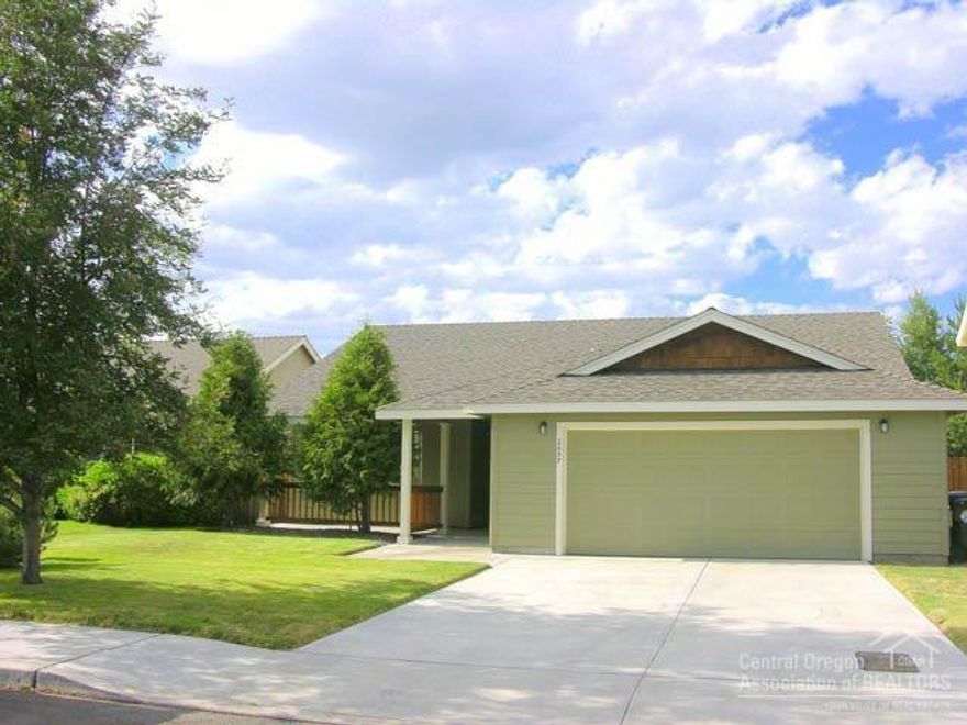 Like-New N.W. Redmond 1700sf Ranch Rambler! Single level 4Bd/2Ba, 2005 home features: tiled entry, archways, vaulted great room w/tiled gas FP, open kitchen w/island, hickory cabs, big pantry, tile back splash, master is located opposite side of home from other 3 beds for privacy is vaulted w/walk-in & archway to private bath, big fenced yard w/raised beds & frame built storage building + patio area, landscaped front w/large covered front porch, shake accents, FA heating & Central AC & newer exterior paint!