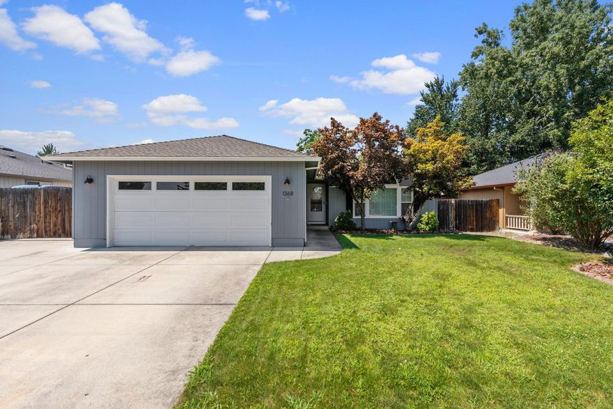 We Have the Key to Your Future!  This single story Decarlow built home offers not only an extra large gated RV parking area, but also an immaculate in ground pool. Inside this stunning South West Medford residence you will find a combination of complementary carpet, tile, beautiful simulated wood flooring, vaulted ceilings, large windows, a step-down living room, separate entry way with coat closet, a sleek kitchen with stone countertops, white cabinetry with contrasting hardware, stainless steel appliances and a connecting dining room with modern pendant lighting that leads conveniently to the back yard from the large sliding door. There is also a mudroom, 2 more sizable bedrooms with a common bath, and a primary suite with a large walk in closet and private back yard entrance. Outside their is low maintenance landscaping, additional storage shed, and 2 car garage.