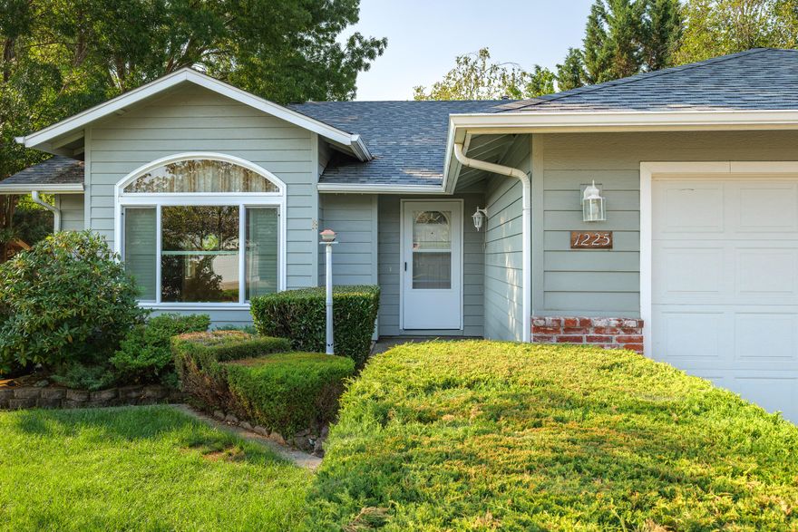 First time on the market! This well-cared-for 3-bedroom, 2-bath home offers 1,465 sq. ft. of comfortable living in an outstanding neighborhood. Built in 1999, the home sits on a large, level 0.18-acre lot. The living room features vaulted ceilings, while the kitchen boasts oak cabinetry, granite counters, and a center island. The generous primary suite includes a walk-in closet and a spacious bath with Culture marble -surround shower. Enjoy outdoor living on the covered deck just off the dining room, overlooking the beautifully landscaped backyard. Additional highlights include a double-car garage, two storage sheds, RV parking, and a fully fenced yard.