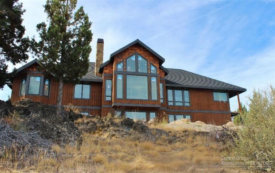 180 mountain views from this gorgeous new Pinnacle Construction home. This 4797 sq ft Awbrey Butte home sits on .55 acres. 5 bedroom & 3.5 bath with lots of extras. Den/office, Billiards room, dedicated in home theater, 2 wet-bars, master on main and 2 kitchens. Beautiful craftsmanship with heavy beam ceilings. Enjoy every comfort with 2 wood burning fireplaces, 2 furnaces w/ AC, on demand hot water tank & 48'sub-zero side-by-side. Outdoor living area features gorgeous mountain views and patio.