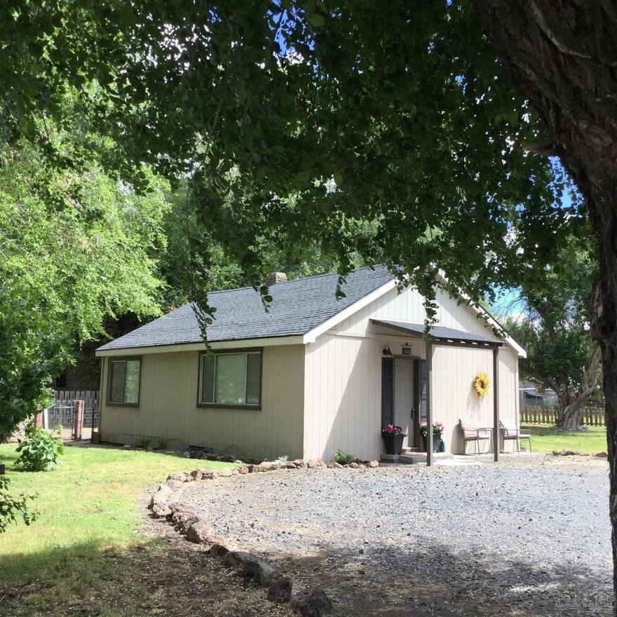 Possibilities in Prineville. Affordable Property for your horse. This acre of land could be a great investment property, close to new hospital and many business possibilities with SRM1 zoning. Cute cottage with tile entryway, high quality carpet, country kitchen, tasteful colors and more. Rustic barn for the animals, well house and storage building too. Lots of parking, rim rock views and priced to move at only $179,900.