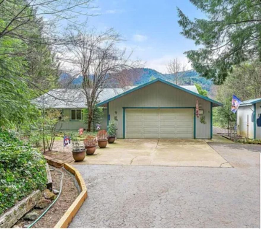 This is a charming 3-bedroom, 3-bath retreat nestled on over 6.19 acres of peaceful, wooded land. This well-appointed home features beautiful luxury plank flooring, a cozy fireplace for winter warmth, and a brand-new HVAC system with a reverse osmosis water filtration system for year-round comfort and convenience.  Enjoy the outdoors with nearby access to the Rogue River, renowned for its world-class salmon fishing, and Lost Creek Lake, perfect for boating, swimming, and weekend recreation. Inside, the home comes fully furnished — including the refrigerator, range, washer, and dryer — making your move seamless and stress-free.  Whether you're seeking a full-time residence or a tranquil getaway, this property offers the perfect blend of comfort, nature, and adventure.