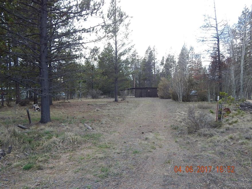 This 1.13 acre lot has easy access to Hwy 97, schools, and downtown La Pine. Nice level lot with power, well, and older septic. Also has a storage shed and carport parking. Priced right too! Don't delay and miss this great opportunity!