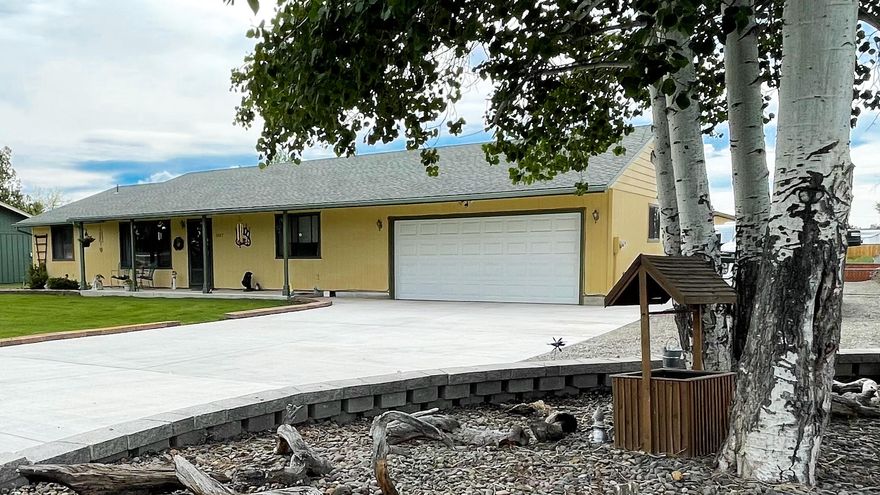 Located just outside of the city limits of Prineville  lies this spacious gem on just over half an acre! Enter this Ranch style home right into the large living room which is open to a recently renovated kitchen with quartz countertops. The kitchen has all stainless steel appliances, custom soft close cabinets, and an induction stove. Home is a split floor plan with a primary en suite. Off the back of the house, is a sunny family and dining room. Exit out to the private patio and gaze upon the beautifully landscaped, grand backyard with a large shop, gazebo, greenhouse, fruit trees, raised garden beds, RV parking, and it's completely fenced. The front and backyard sprinkler system and gravel beds make for low maintenance. Tennessee Lane dead ends just a few houses down; creating a quiet park-like neighborhood.