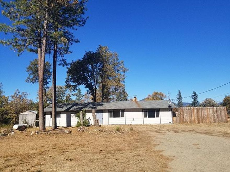 Ranch style 3 bed, 2 bath home on a flat useable acre set back off the road in Merlin. Gas stove, large family room with wood stove, some laminate wood floors. Covered concrete back patio. Partially fenced back yard. Shed. Chicken Coop. Low County Taxes. Strong Well Area. New Carpet laid. Home Inspection & Pest & Dryrot Inspections done, repairs underway for clean P&D... new chimney pipe for certified woodstove too. Last deal fell apart due to no fault of seller/property. This is a great value for a lucky buyer.