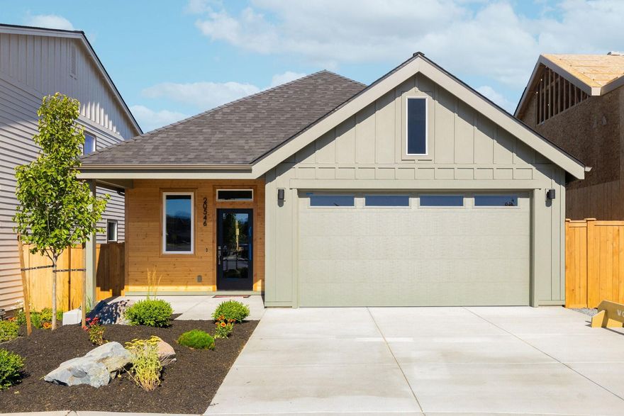 Gorgeous view of Broken Top/3 Sisters from this convenient single level home close to schools and shopping. This contemporary home features a bright kitchen and dining area, great room with gas fireplace, primary bedroom suite, 2 additional bedrooms, bath & utility room. The kitchen features solid surface counters, tile backsplash, island and stainless steel appliances. Wood composite floors throughout main living area, bathrooms and utility room. Bathrooms feature solid surface counters and backsplash. Primary has dual vanity, tile shower & walk-in closet. Sliding doors lead to a covered deck for convenient outdoor living space. Front/rear yard landscape, fenced yard, custom built-ins, Central AC, window coverings, refrigerator, washer/dryer and epoxy garage floor included!
