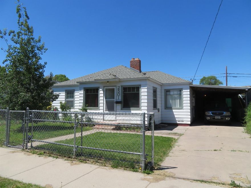 Cute 2 bedroom, 1 bath, dining nook. Wood floors & vinyl. No carpet! and Real Fireplace, bonus room off carport for a den or office. Carport, big fenced lot, front and back. Alley access,patio and close to transportation and Fred Meyer.