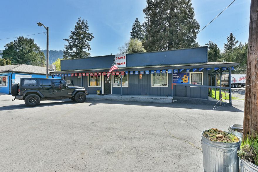 Location Location Location!!!  The most important aspect to any business. Welcome to one of the only Historic Rogue River Taverns! This is a Turnkey commercial space and running business that invites you to bring the food, beverages, and people. Open inviting floor plan with seating inside and out. Walk in Cooler, Panty, sinks, storage areas, tables, charis, bar stools.  Located right on Rogue River Highway between Rogue River and Grants Pass makes this business on the path of many patrons throughout the day. This has been a very busy establishment and just needs you to make your dreams come true to run your own lucrative business.