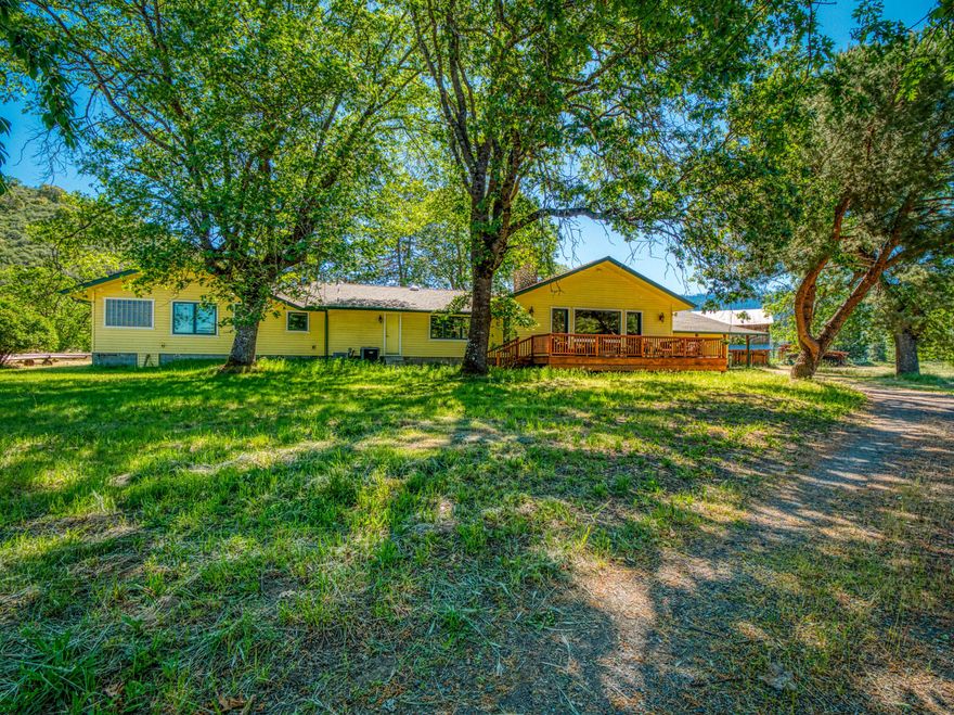 This Applegate Ranch/farm is perfect for many agricultural pursuits located in one of the most desirable spots in the Rogue Valley. Original Applegate River water rights for this EFU zoned property.  The home is  remodeled and exquisite with a huge master suite with  a den area, massive walk-in shower.  The living room has vaulted ceilings and great views of the property, amazing chefs kitchen with sub-zero fridge and gas cooking. There  is a wrap around deck and covered patio for entertaining. This property is located in the heart of the Applegate surrounded by vineyards and small estates. 25 irrigated acres of fertile land with cannons, irrigation pipes, and equipment to water. There are several outbuildings including a 2550 sqft commercial greenhouse with electrical that was built in 2017.  In addition, the property is fenced and has one acre fenced in with solid wood fencing.  Other outbuildings include a flex space shop/garage, large open equipment shed, and a vintage barn.