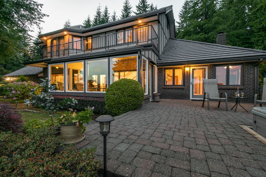 Absolutely stunning view from this beautiful hillside estate! Meticulously maintained w/ new roof, windows, & ext paint, this home features 3 bedrooms, an elevator, office, media room, & finished storage room over the garage. Shop w/ half bath is wired for 220. Greenhouse & tiered garden w/ berries & fruit trees. Incredible land topography, merchantable timber, & trails through the trees. Two lots total, including a 2+ acre parcel zoned residential. Southern exposure & vineyard suitable soils.