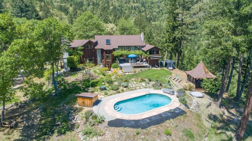 Looking for Backup offer-Beautiful 3bed/2.5ba home situated on 285 ac of mature timber/hardwoods,5 min outside Jacksonville but a million miles away..  spectacular views of Mt. McLoughlin and city lights below. Hardwood floors  though out with vaulted ceilings, wood stove, quartz rock fireplace.  High-end stainless appliances and granite counters in the chef's kitchen.  2 full baths feature claw foot soaking tubs.  Back yard has in ground pool, gazebo w/jacuzzi and fruit trees w/deer fenced landscapiing.  The land offers several shooting ranges and a 40 x 60 ''shop with solar power.  Large enough to store all your toys. Two highly maintained cottages are 2 bed/1 bath with hardwood floors & spanish tile.  New heat pumps, wood stoves and individual laundry facilities make for great rental opportunities or for family to live close.  The property has an extensive trail system that has been developed over the last 16 years.   Gated property has beauty, privacy, and the ultimate locatio