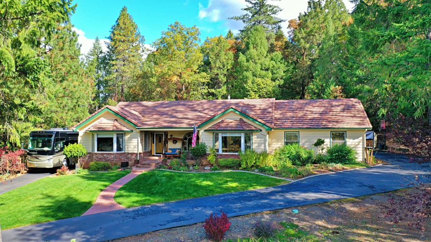 Come take a look before this well maintained home is gone. This 2662 sq/ft, 4 bedroom, 3 bathroom, 2x6 framed home shows pride of ownership thru-out. There are 2 master suites with full bathrooms, great room, office, living room, laundry room with walk-in pantry, garage & heated/cooled shop connected by a breezeway, paved driveway & RV parking with full hook ups with its own deck. Nestled in a 2.92 acre property at the end of quit cul-de-sac. The home offers vaulted, tongue & groove ceilings with wood beams in the master bedroom, kitchen & great room that add depth & beauty to the interior, the kitchen has a granite counter island with eating bar & slab quarts counter top, the luxury vinyl plank flooring adds a truly welcoming feeling. The wood fire place in the great room keeps the whole house warm & the large brick hearth allows for enjoying the fire while sitting around the stove. New tile roof, skylights, gutters, exterior painting, Trex deck & kitchen renovation completed in 2016.