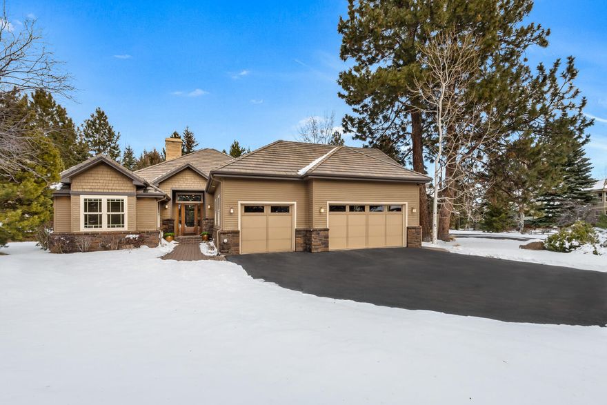 This stunning Broken Top home showcases a bright and spacious interior, elevated by high ceilings, tall windows, and rich finishes. Custom cabinetry adds timeless elegance, complementing the open great room with a wide stone gas fireplace. The thoughtfully designed floor plan features single-level living with an upstairs bonus/theater room, a large island kitchen perfect for entertaining, and a third bedroom that doubles as a den or office with a built-in desk and bookcase. Surround sound enhances every space, creating an immersive experience. The luxurious primary suite offers a spa-like retreat with a soaking tub, a two-head walk-in tile shower, and a generous walk-in closet. Situated on a beautifully landscaped 0.32-acre corner lot, this home also boasts an oversized three-car garage with abundant storage, making it as functional as it is beautiful.