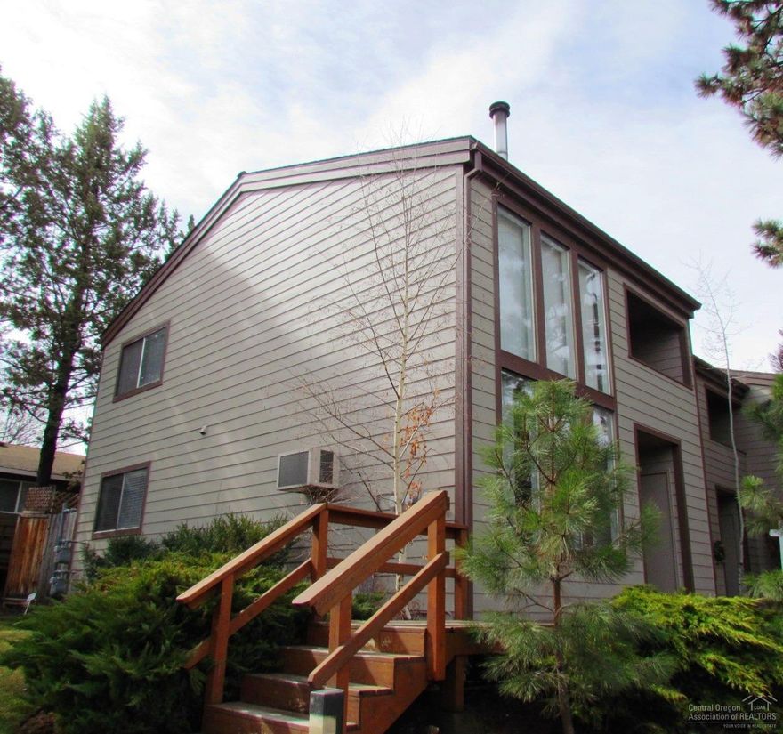 Located in the desirable Northwest section of Bend close to the Deschutes River with easy access or walking to downtown for shopping and dining opportunities or near by parks. End unit with a full bedroom plus a loft bedroom, new interior paint, clean and move in ready. High ceilings with high windows for lots of natural light. The building exterior was recently painted. Fenced back yard and common area lawn on the side. Located in a quiet neighborhood. Very low HOA's covers water, sewer, garbage, landscape maintenance, exterior building maintenance and building insurance. Air Conditioner will be replaced prior to closing. Seller's want it SOLD and will look at all reasonable offers!