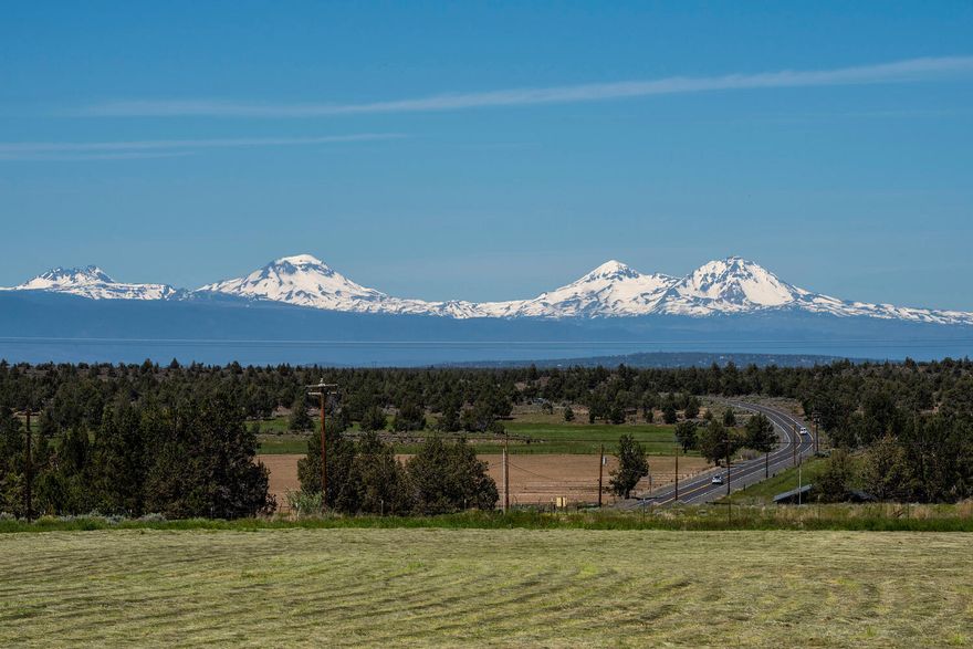 Breathtaking unobstructed mountain views! Check out this completely remodeled home on 9.27 aces with 7.5 acres of irrigation! Opportunity abounds with this 1860 sq ft single level home with huge 48 x 30 heated shop/pole barn with 2- 16' doors. Open kitchen with quartz counters, farm sink, SS appliances, wood beams, and new laminate floors through most of the home. Large bedrooms, expansive windows, tiled bathrooms, open floor plan, to much to mention. Enjoy your views of the mountains and pastures. Wood burning fireplace for cozy feel.  This home also offers a bar area with beverage fridge and large laundry/mud room. All new mechanicals includes new HVAC with air conditioning and water heater. Attached 2 car garage plus your shop/pole barn means lots of storage for your toys, tractors and equipment. Newer roof, fully fenced horse property just 20 minutes to Bend.