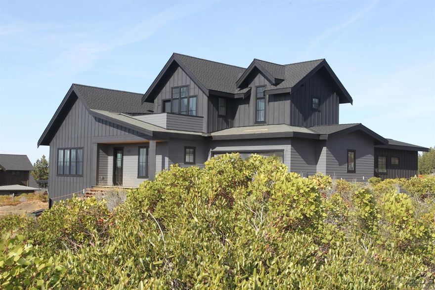 This soon to be completed custom home strikes a perfect balance between traditional farmhouse architecture & sophisticated contemporary living. Functionality and charm are at the heart of this Visionary Homes build, one of Central Oregon's leading builders. Tall windows provide natural light & optimal views of the Cascades & adjacent Alpine Park. A modern layout incorporates both light & dark elements for added visual interest. Enjoy a modern farmhouse kitchen w/ open shelving, sleek quartz counters & full appliance pkg. The dining area has large sliding glass doors that draw the eye out to a fully landscaped yard w/ gas fire pit. This ties to the Alpine Park trail system & the great outdoor living that Bend has to offer. An open layout allows for ease of entertaining & mainly ground level living including a great room, master, mud room & utility room w/ convenient dog washing station. Upstairs, a loft style bonus room w/ deck facing the mountains & 2 more beds & baths.