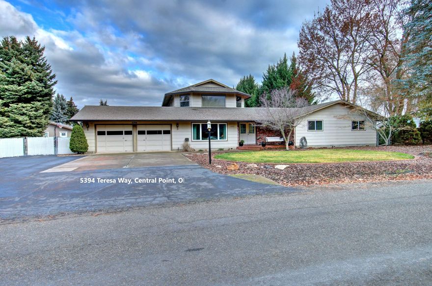 Dreaming of Tranquility of Country Living w/the Luxuries of the City?  This hard to find property is on city water, sewer, AND has 2 wells for all your watering needs!  There is a 3000+ sf 4 bedrm/3 bathrm home AND a gorgeous guest house w/ 2 bedrooms! The main home features; spacious kitchen, pantry/laundry rm, sunrm, living rm, family rm w/ fireplace, & a huge upstairs bonus rm.  Master bedrm suite & 2 bedrms on the main level.  Upstairs is a HUGE bonus rm, full bath, & additional rm- currently used as 4th bedrm. Off the upstairs bonus rm is a large covered deck- perfect for enjoying Hot Summer nights! This home offers plenty of room for a home office, homeschool, & multi-family living.  Across the property is the well- appointed guest home. Step outside to the backyard & fall in love with the space- room for ALL your toys, RV parking w/ hookups, tons of paved parking, garden area, fruit trees, huge lawn area w/inground sprinklers,  patio for Summer BBQ's, No homes behind – MUST SEE!