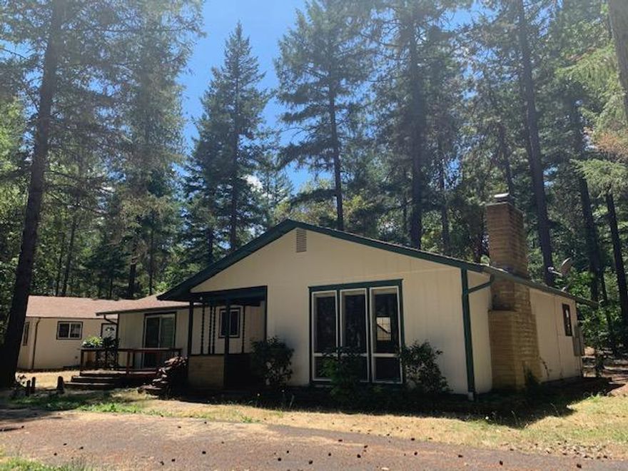 Close to Griffin Park for fishing, rafting, boating or just relaxing on the Rogue River. Newly remodeled 1476 sq ft. dwelling with adjacent 816 sq. ft guest apartment and separate 1296 sq. ft. manufactured home without kitchen (nice Shop)Nestled in the pine trees. The upgrades include new painting, flooring, carpet and too much to be listed without showing you first. Lot's of deer, turkey, and squirrels to entertain you. Separate storage sheds, back up generator included that can operate house, studio apartment and shop for two months off the grid and the location of this rare gem of a property. Level acreage with great garden area, privacy, and quiet neighborhood.