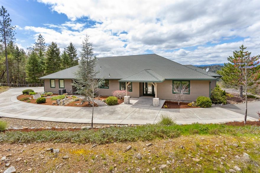 Gorgeous Custom Built home with beautiful mountain and city views. Home features 3 bedrooms, 3 baths with 3411 sf, built in 2003. Great room with Port Orford vaulted ceiling and a wall of windows to enjoy the views; propane Fireplace. The cook in the family will love the kitchen with granite counters, walk-in pantry, double ovens, cherry and oak cabinets, wine fridge and formal dining room. Master suite will be your spa getaway with jetted tub, dual sinks and walk-in closet. Additional master suite with full bath and walk-in closet. Split bedroom floor plan, central vac, Cedar siding and Brazilian Cherry floors. Attached 3.5 car finished garage with shop area and utility sink. Garden area is fenced with shed for gardening items. Amazing new Legacy pool that is fenced and plumbed for hot tub. Gated and fenced 4.85 acres.