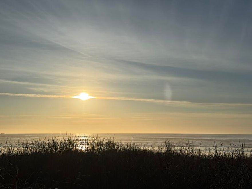 This Oceanfront property is a must see for yourself!! Located in the desirable community of Sandpiper Village, enjoy breathtaking sunsets and direct beach access just steps from your door. This beautifully updated unit features modern flooring, new quartz countertops, black SS appliances, and a new Kohler walk in shower. The open-concept living space is enhanced by vaulted ceilings and a cozy fireplace, creating the perfect setting for relaxing or entertaining with panoramic ocean views.